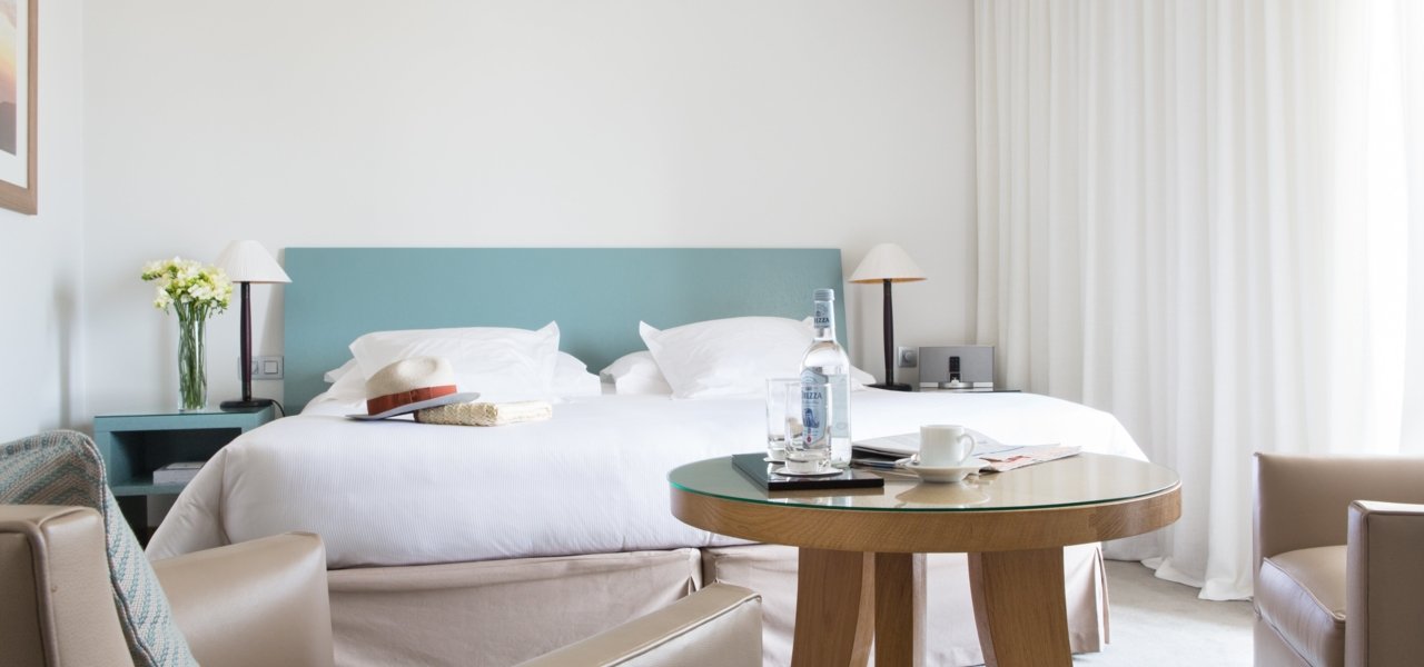 Bedroom with bottles on table - Wine Paths